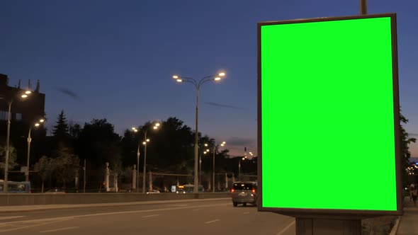 Citylight Box with Green Screen Stands on Dark Street alt