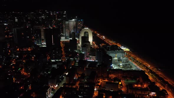 Batumi, Georgia - July 15 2022: Drone flies along new Batumi boulevard at night alt