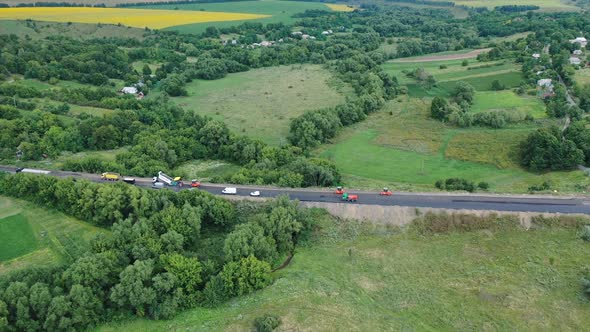 Aerial view of the road among nature. Side view of the highway  alt
