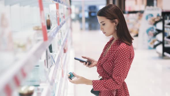 Beautiful Young Brunette Girl Taking Pictures of Products in Shop alt