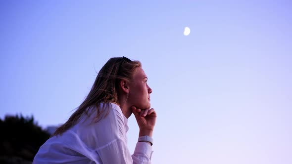 Nice Attractive Blonde Young Woman at Sunset on Background of Moon in White Shirt and Black Top alt