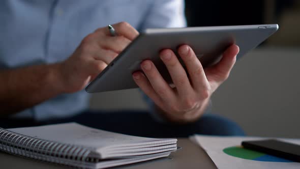 Executive Hands Using Tablet Digital Device Browsing Network Data in Office alt