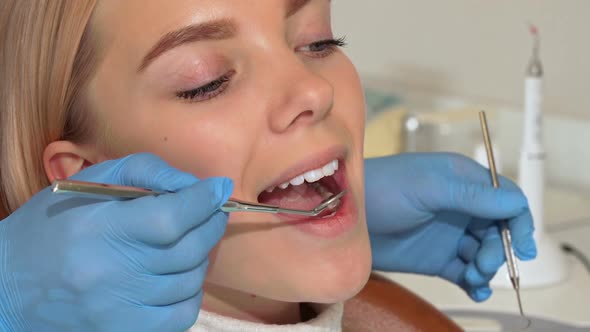 Attractive Woman with Perfect White Healthy Teeth Having Oral Checkup alt