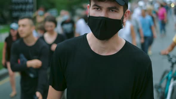 March Resistance Strike of Masked Protesting People Under Lockdown Restriction