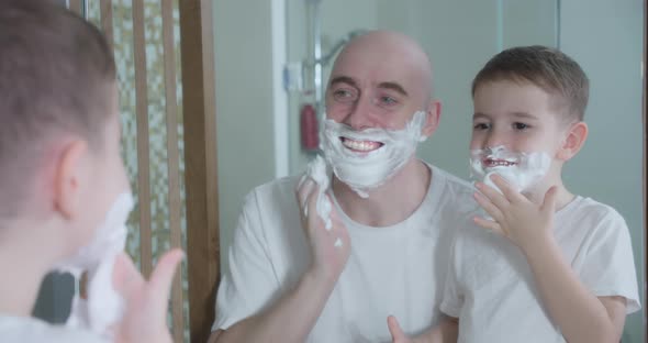 Father Teaches Son to Shave alt
