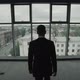 Man in Suit Look at Panoramic Window with Old Town View - VideoHive Item for Sale