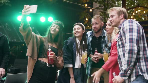 Group of Female and Male Friends are Celebration Party and Making Selfies Photo on Mobiles alt