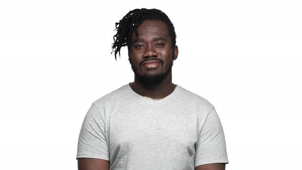 Portrait of Satisfied African American Man in Casual Tshirt Smiling Broadly at Camera with Perfect alt