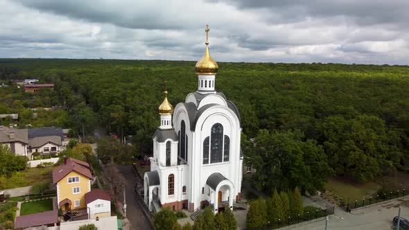 Kharkiv city cathedral in forest aerial fly around