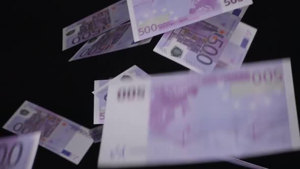 Euro Bills Fall Down On A Black Background