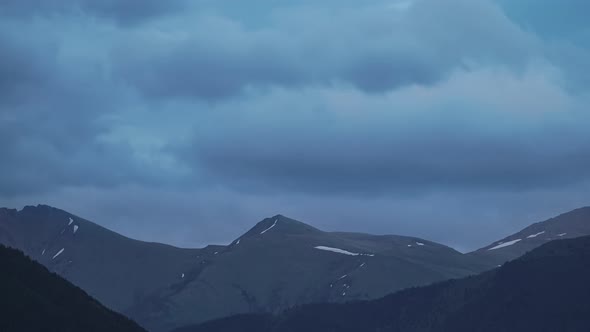 Caucasian Mountain Peak Covered with Snow in Cloudy Evening in Twilight