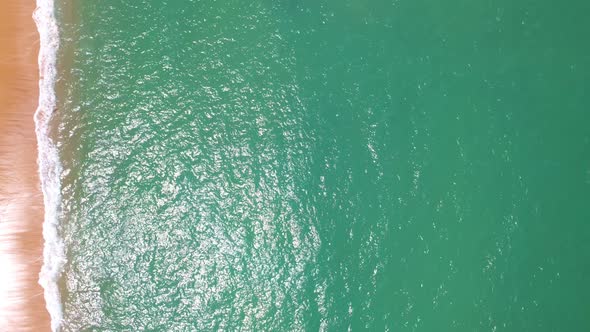 Beautiful waves Foaming and Splashing on the beach sand. Ocean sea alt
