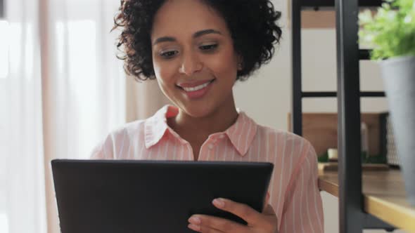 Smiling Woman with Tablet Pc Computer at Home