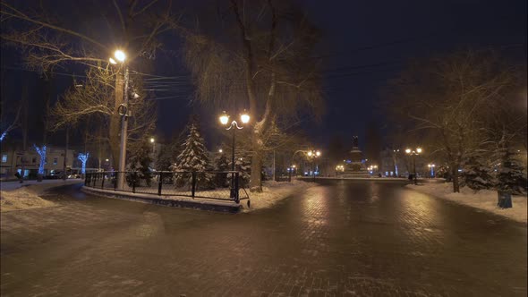 Passers Are Walking on Place of City in Night Time in Winter, Motion Time Lapse
