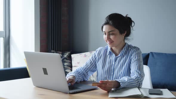 Business woman shopping online. Girl making online payment with credit card. alt