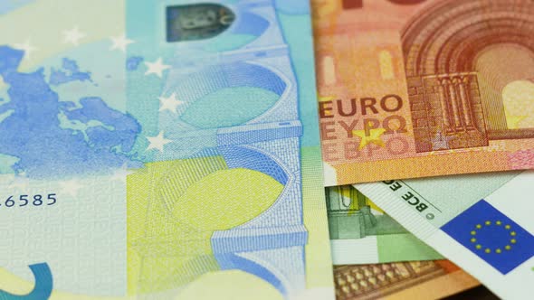 Close up of cash 20, 50, 100, 500 euros being thrown alt