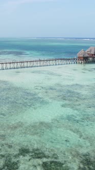 Tanzania  Vertical Video House on Stilts in the Ocean on the Coast of Zanzibar Slow Motion alt
