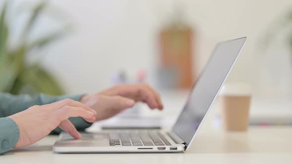 Typing on Laptop alt