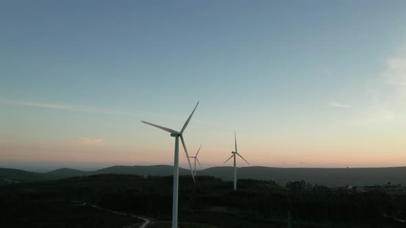 Turbines Of Electric Generators During Sunset With Mountain Silhouette In Serra de Aire e Candeeiros