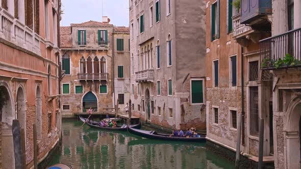 Gondolas Cross Canals at Day Venice Italy
