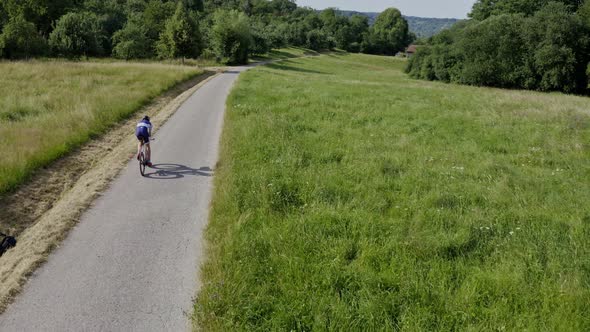 Drone shot of a speedy racing cyclists alt