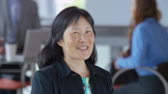 Portrait of mature Asian businesswoman