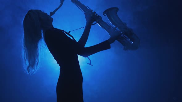 Silhouette of Girl Playing Saxophone