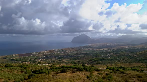 Amazing aerial timelapse of Monte Cofano Sicilian natural reserve close to San Vito Lo Capo in Italy alt
