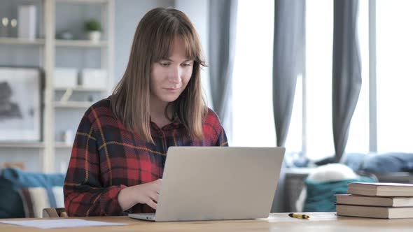 Excited Casual Young Girl Celebrating Success Working on Laptop alt