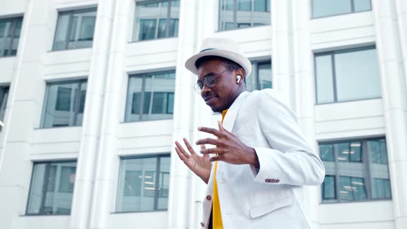 Inspired black street dancer in white suit with hat alt