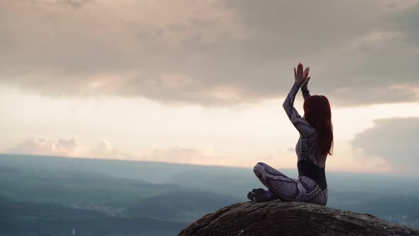 Girl Practices Yoga While Sitting in Lotus Position Beautiful Mountain Landscape alt