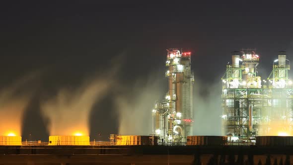 Time-lapse of Oil refinery industrial plant with sky at night, Thailand