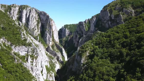 Amazing aerial view of Turda Gorge. Steep grey cliffs and the narrow canyon of this nature preserve alt