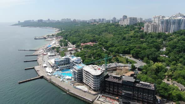 Aerial Footage of a Resort with an Outdoor Pool on the Shore of Dnipro River alt