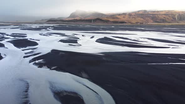 Aerial View of Patterns of Icelandic Rivers Flowing Into the Ocean Unusual Beautiful Landscape alt