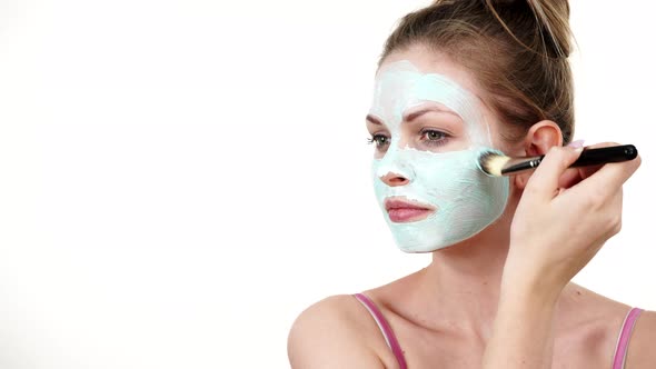 Girl Apply Green Mud Mask to Face