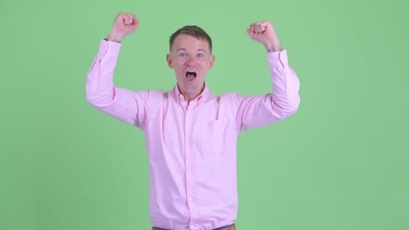 Portrait of Happy Businessman Getting Good News alt