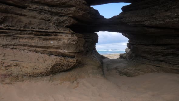Eroded rock formation at an Australian beach. Erosion has caused two holes to be formed. alt