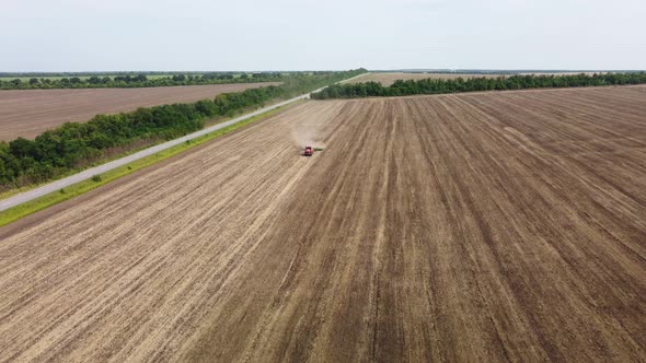 Cultivation of Soil By Tractor View From a Height