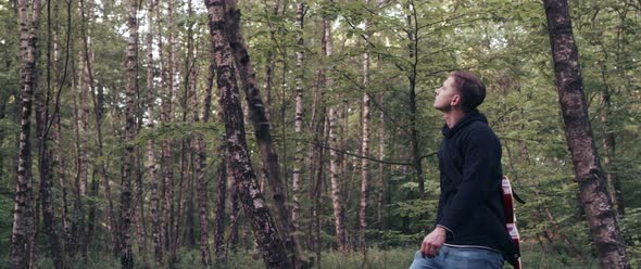 Guitar Player in the Woods alt