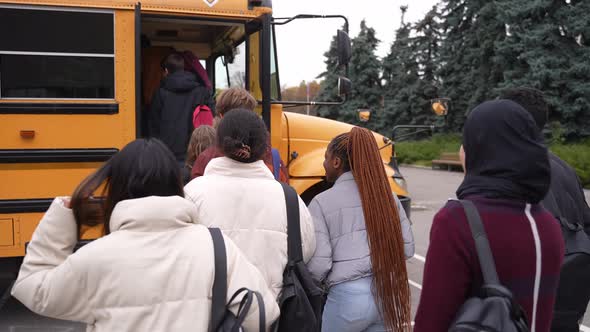 Multinational Teenage Pupils Getting on School Bus alt