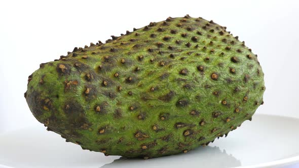 One Whole Soursop Graviola Exotic Tropical Fruit Guanabana on Plate Rotate alt