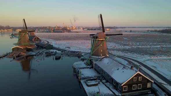 Wooden Wind Mill at the Zaanse Schans Windmill Village During Winter with Snowy Landscape Snow alt