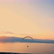 Silhouette of Paragliding Flying in air Against Sunset Sky - VideoHive Item for Sale