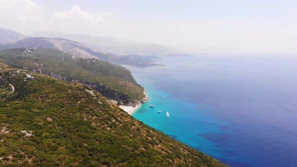 Aerial Drone View of Gjipe Beach and Canyon Dhermi Albania Hidden Paraside with Boats Tourists alt