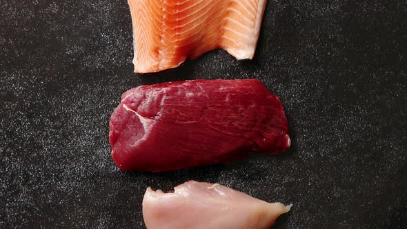 Fresh Raw Beef Steak, Chicken Breast, and Salmon Fillet alt
