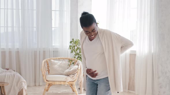 Young African American Pregnant Woman Holding Tummy Belly Expecting Future Mom Screaming Suffering alt