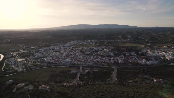 High rising aerial of the portuguese city Silves and the Arade river alt