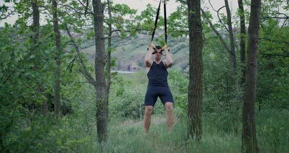 Athletic Man Using Sport Slings alt