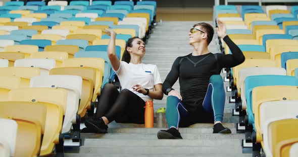 Couple of Athletes Giving High-Five